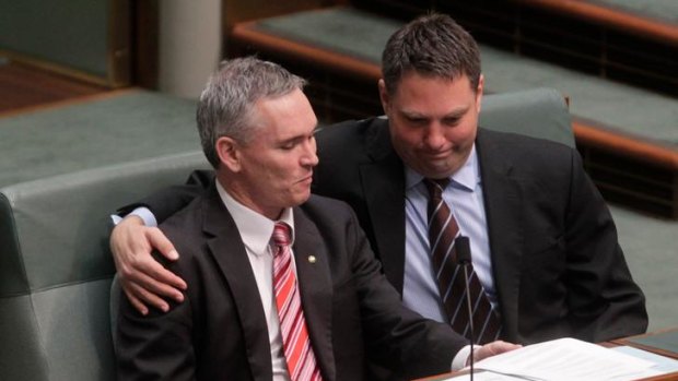 A friend in need: Embattled MP Craig Thomson receives a supportive hug from fellow Labor MP Richard Marles during a procedural vote yesterday.