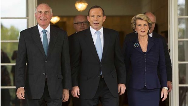 Acting Prime Minister Warren Truss, pictured with Prime Minister Tony Abbott and Foreign Affairs Minister Julie Bishop, says he expects some of the government's decisions will be unpopular.