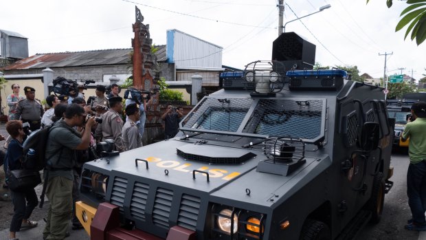 Armed police vehicles complete a practice run to the parole offices in Denpasar, where Corby will have to sign papers before being deported.