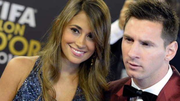 Beaten to the top award: Lionel Messi with his wife Antonella.