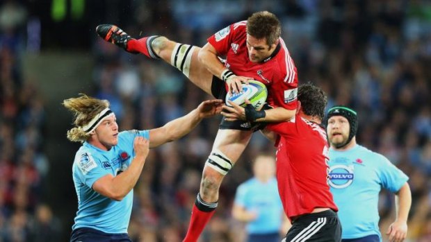Brought down to earth: Richie McCaw's Crusaders came off second best in the battle of the back-rowers.
