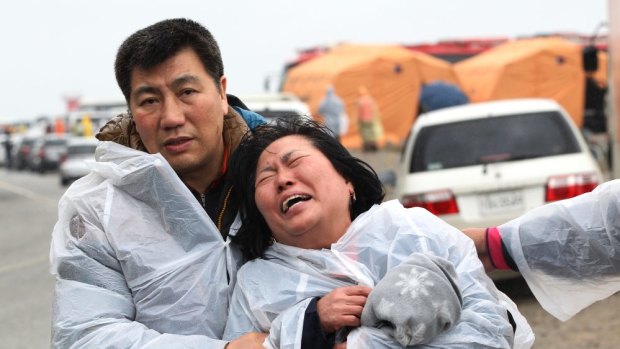 Grief ... A relative of a passenger aboard a sunken ferry weeps at a port in Jindo, South Korea.