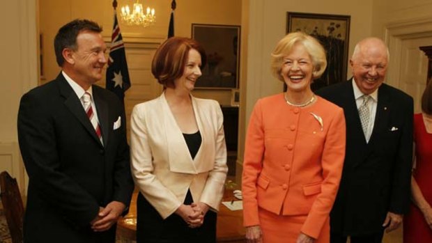 Julia Gillard is sworn in as Prime Minister by Governor-General Quentin Bryce at Government House in Canberra, with her partner Tim Mathieson, left, and Michael Bryce.