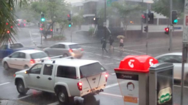 Rain lashes the Brisbane CBD.
