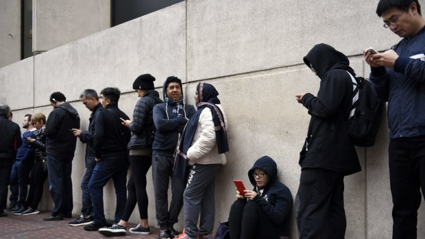 Yes, people did queue outside Apple stores around the world to get their hands on the latest iPhones. But it was a far cry from previous launches.