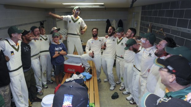  Weston Creek players celebrate their win in the change rooms.