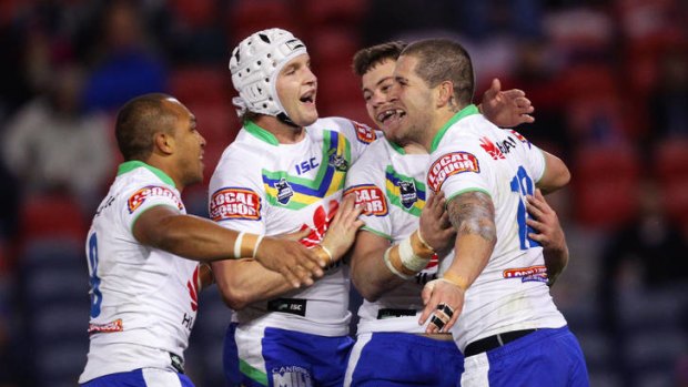 The Raiders celebrate Joel Thompson's try against the Knights. A week-long bonding camp in the lead-up to the match proved crucial to the win.