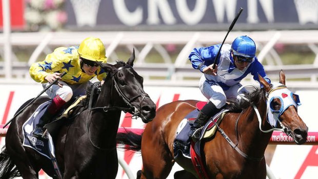 Fly-in win: Jamie Spencer (left) rides Side Glance to victory in the Mackinnon Stakes, defeating Chris Munce on Dear Demi.