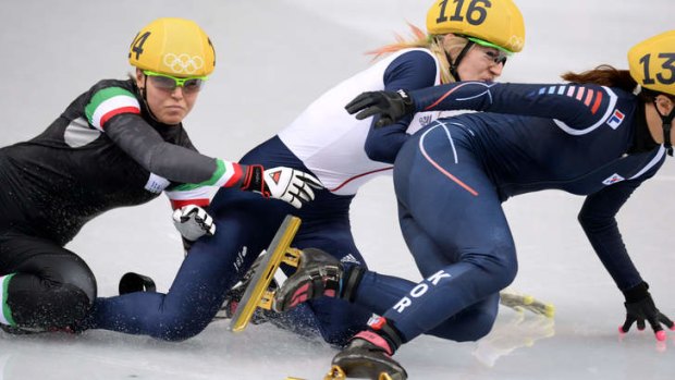 Great Britain's Elise Christie (centre) causes a crash during the 500m short track final.