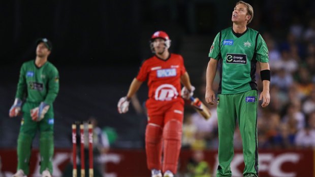 Eyes to the sky: Shane Warne is hit for six by the in-form Aaron Finch.
