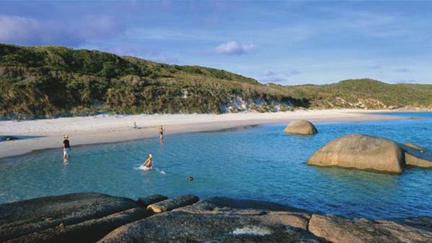 Greens Pool at William Bay National Park is rimmed by beach and stone.