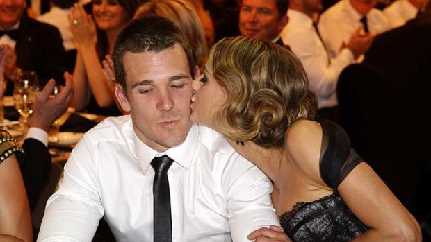 Dane Swan gets a congratulatory kiss from girlfriend Taylor Wilson after winning the Brownlow Medal.
