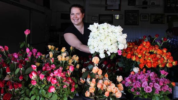There's no stemming the tide &#8230; Anastasia Chartorisky of Nati Brothers Roses readies for the Valentine's Day onslaught.