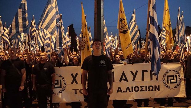 "Greece belongs to the Greeks": Members and supporters of the extreme right party Golden Dawn march through central Athens.