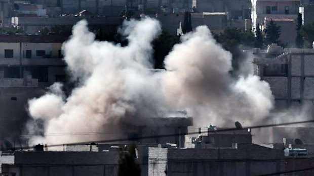 Smoke rises from the Syrian town of Ain al-Arab, known as Kobane by the Kurds, as Islamic State jihadists push to take the town.