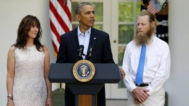 US President Barack Obama stands with  Jami Bergdahl, left, and Bob Bergdahl, right, the parents of Bowe Bergdahl.