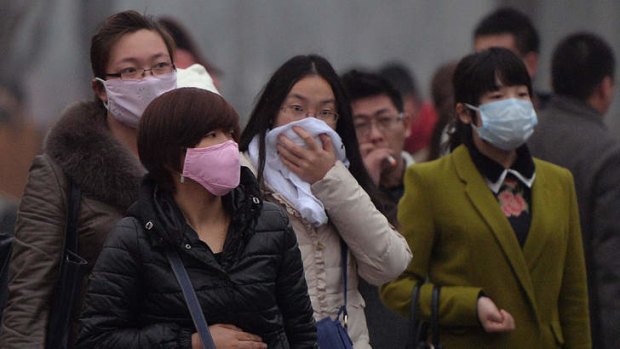 Run for cover: Chinese commuters in February, when smog reached "crisis" levels.