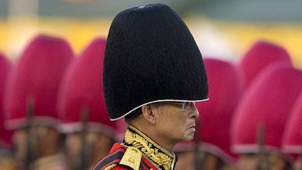 Thailand's King Bhumibol Adulyadej attends the annual Trooping of the Colour military parade in Bangkok's Royal Plaza. The Thai king, the world's longest-reigning monarch, will turn 81 tomorrow.