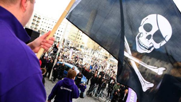 A supporter of filesharing websiteThe Pirate Bay waves a Jolly Roger flag during a demonstration in Stockholm in 2009 Photo: Reuters/Fredrik Persson