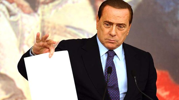 Italy's Prime Minister Silvio Berlusconi announces the new austerity plan approved by his government's Cabinet.