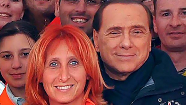 "I wouldn't mind being resuscitated by you." ... Italian Prime Minister Silvio Berlusconi poses with Dr Fabiola Carrieri.