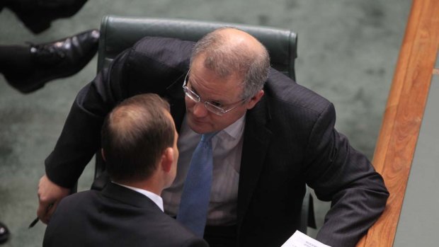 Opposition Leader Tony Abbott and immigration spokesman Scott Morrison in Parliament this afternoon.
