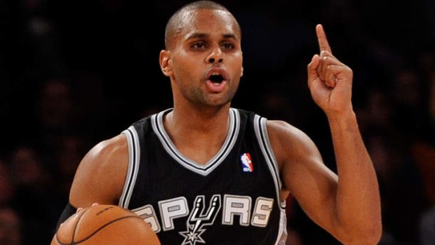 Point guard Patty Mills of the San Antonio Spurs calls a play during the second half against the New York Knicks at Madison Square Garden.