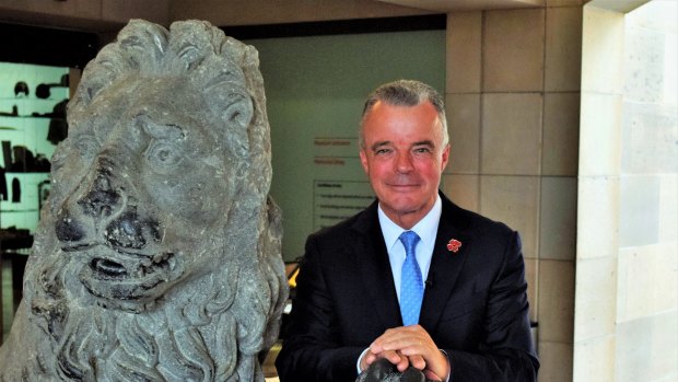 AWM director Dr Brendan Nelson with one of the Menin Gate lions.