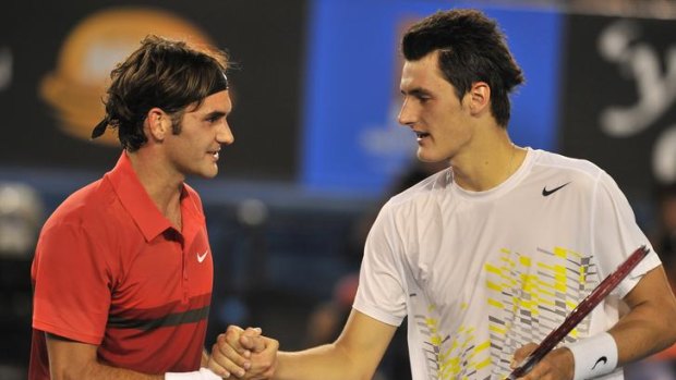 Bernard Tomic and Roger Federer on Rod Laver arena.