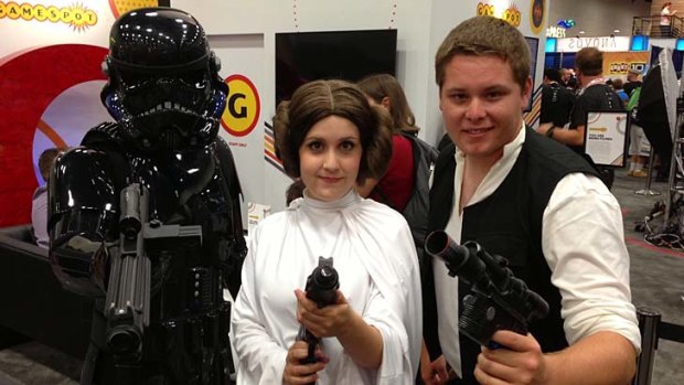 Devotees in all shapes and sizes: From left, a shadow stormtrooper, Princess Leia and Han Solo from Star Wars.