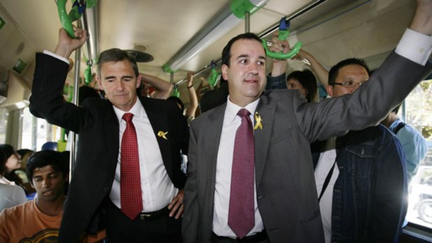 Martin Pakula catches a tram with John Brumby after being sworn in at Government House.