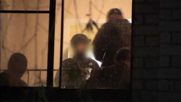 Police in a Sydney house during recent anti-terror raid: A bipartisan committee has recommended safeguards to be applied on the new anti-terrorism laws.