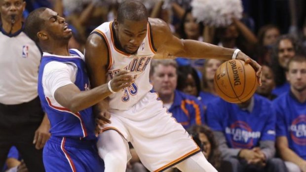 Winning performance: Clippers’ Chris Paul (left) makes life difficult for Thunder’s Kevin Durant. 