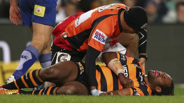 Lote Tuqiri ... down with a broken arm in the match against the Bulldogs.