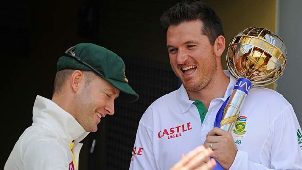 Graeme Smith and Michael Clarke share a laugh yesterday.