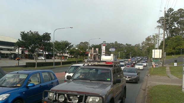Peak-hour traffic backs up on Moggill Road.
