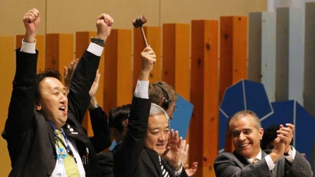 Japanese Environment Minister Ryu Matsumoto raises the hammer to declare the closing of the UN biodiversity summit in Nagoya.