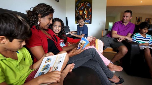 Anita and John Riley with four of their six children (from left) Benji, 7, Jasmine, 9, Ari, 13, and Zachy, 11, who they home school in their home in Erina on the Central Coast of NSW.