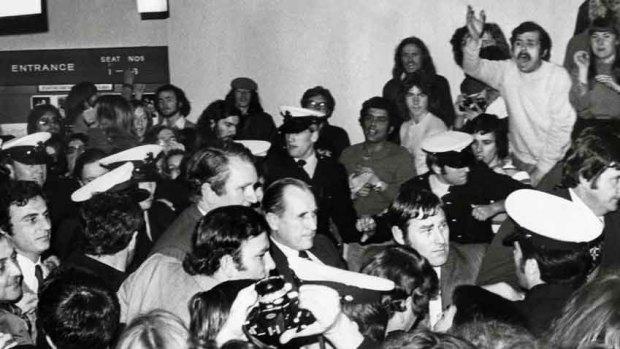 Caught in the crush: Malcolm Fraser surrounded by police and protesters.