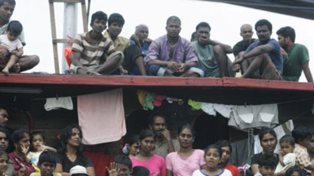 ‘‘We are not animals. We are not dogs’’ ... Sri Lankan asylum seekers on their boat in Cilegon, Banten province, in Indonesia