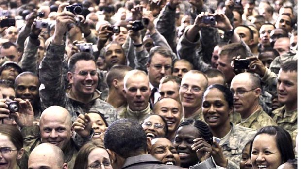 Close relationships ... Barack Obama greets troops at a rally during a visit to Afghanistan last year.