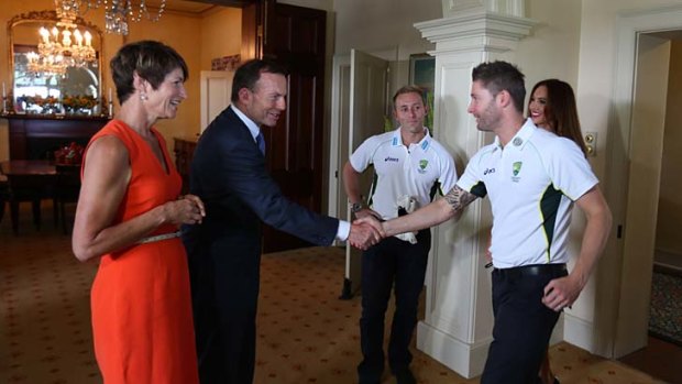 Welcome: Margie and Tony Abbott say hello to Australia captain Michael Clarke.