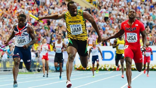 Jamaica's Usain Bolt (centre) crosses the finnish line ahead of Justin Gatlin (right) and Great Britain's Dwain Chambers in the men's 4x100 metres relay at the world athletics championships in Moscow on Sunday.