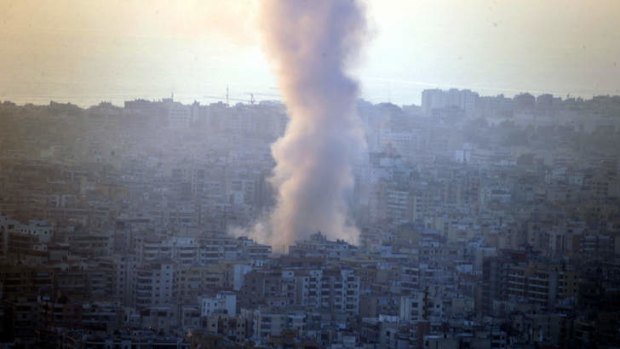 Smoke seen from Mount Lebanon rises from the site of a car bomb explosion in southern Beirut, Lebanon.
