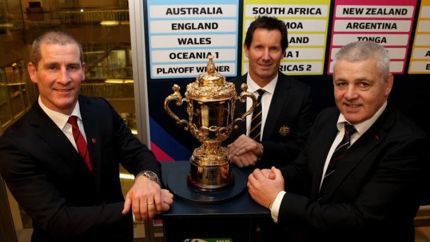 Rivals ... Stuart Lancaster (England), Robbie Deans (Australia) and Warren Gatland (Wales) pose with the Webb Ellis trophy.