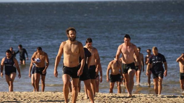 Melbourne Rebels players hit the beach yesterday after Friday's loss.