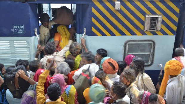 Ben Groundwater was bitten by the travel bug amid the congestion of boarding a train in India. 