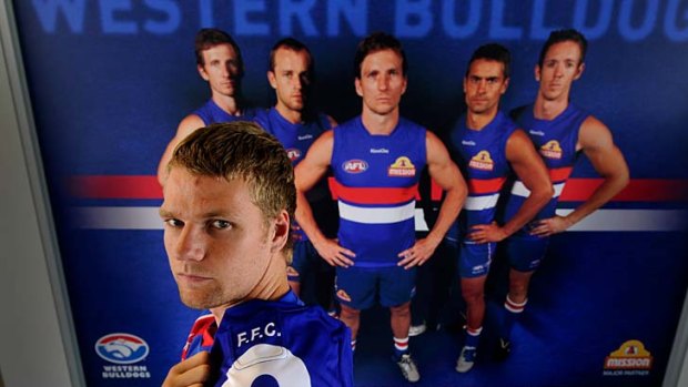 Proud Bulldog: Jake Stringer with the No. 9 guernsey he will wear for the Western Bulldogs.