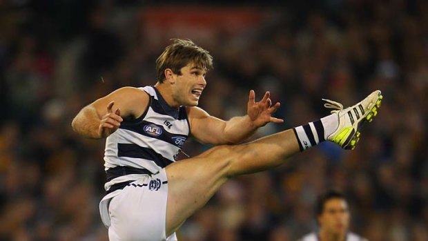 Tom Hawkins kicks a goal after the siren to give Geelong victory over Hawthorn in round 19.