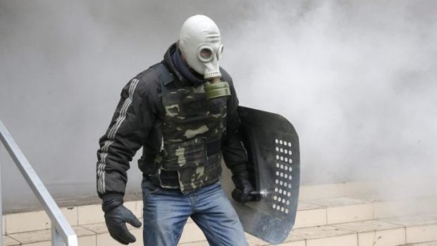 A pro-Russian activist stands during the mass storming of a police station in the eastern Ukrainian town of Horlivka. 